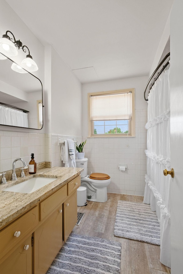 93 Hilltop Dr, Columbia, TN 38401 - bathroom featuring tile walls, vanity, toilet, and wood finished floors