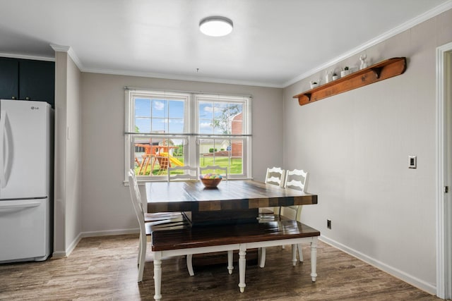 93 Hilltop Dr, Columbia, TN 38401 - dining room with light wood-style floors, ornamental molding, and baseboards