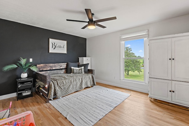 3055 Carters Creek Pike, Franklin, TN 37064 - bedroom with light wood finished floors, baseboards, and ceiling fan