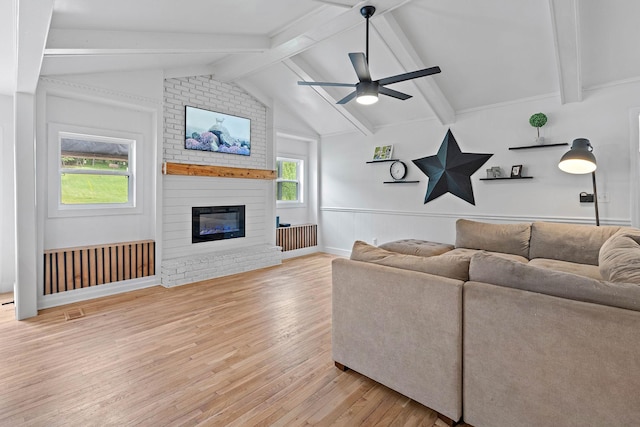 3055 Carters Creek Pike, Franklin, TN 37064 - living area with light wood-style floors, a ceiling fan, and a fireplace