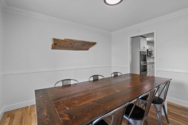 3055 Carters Creek Pike, Franklin, TN 37064 - dining room featuring baseboards, light wood finished floors, and ornamental molding