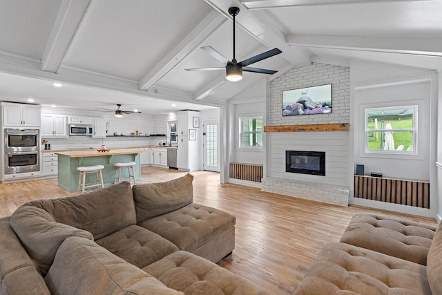 3055 Carters Creek Pike, Franklin, TN 37064 - living room featuring ceiling fan, light wood-style floors, a brick fireplace, and recessed lighting