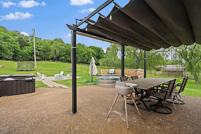 3055 Carters Creek Pike, Franklin, TN 37064 - view of patio featuring a hot tub, a trampoline, and outdoor dining area