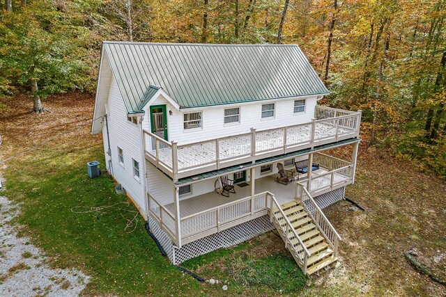 108 Lanham Ln, Monroe, TN 38573 - exterior space featuring metal roof, a wooden deck, a yard, and a wooded view