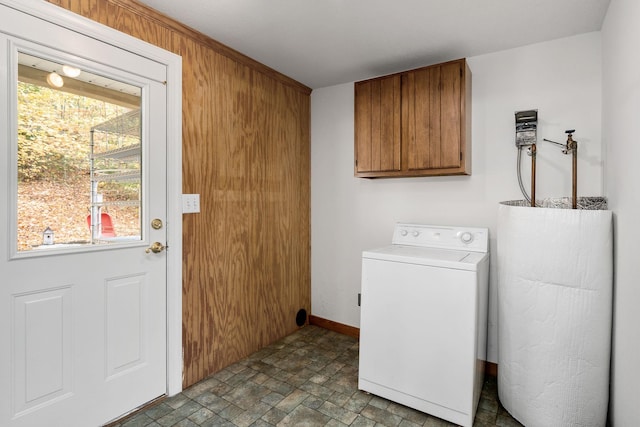 108 Lanham Ln, Monroe, TN 38573 - laundry area featuring cabinet space, washer / dryer, stone finish flooring, water heater, and baseboards