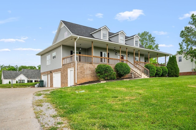 830 Blakemore Rd, Dickson, TN 37055 - farmhouse featuring covered porch, driveway, a front yard, brick siding, and an attached garage