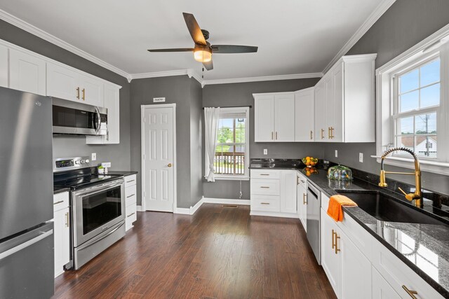 830 Blakemore Rd, Dickson, TN 37055 - kitchen with ceiling fan, dark wood-style flooring, a sink, white cabinets, and stainless steel appliances