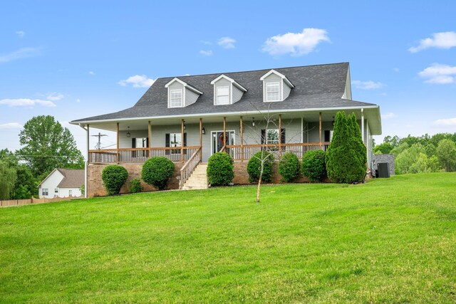 830 Blakemore Rd, Dickson, TN 37055 - farmhouse with a porch, roof with shingles, central air condition unit, and a front yard