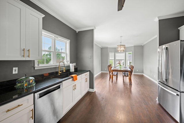 830 Blakemore Rd, Dickson, TN 37055 - kitchen with dark countertops, a sink, dark wood-style floors, a chandelier, and stainless steel appliances