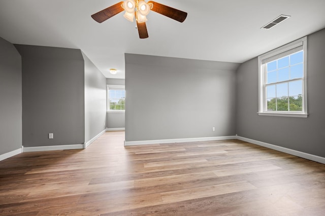830 Blakemore Rd, Dickson, TN 37055 - empty room with visible vents, a ceiling fan, light wood-style flooring, and baseboards