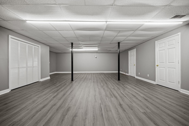 830 Blakemore Rd, Dickson, TN 37055 - finished basement featuring visible vents, baseboards, a paneled ceiling, and wood finished floors