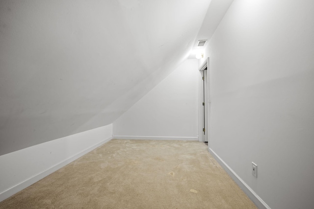 830 Blakemore Rd, Dickson, TN 37055 - interior space featuring baseboards, light carpet, vaulted ceiling, and visible vents