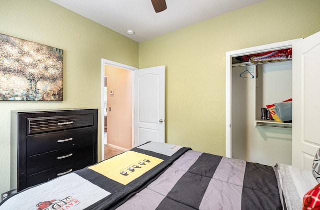 bedroom with ceiling fan and a closet