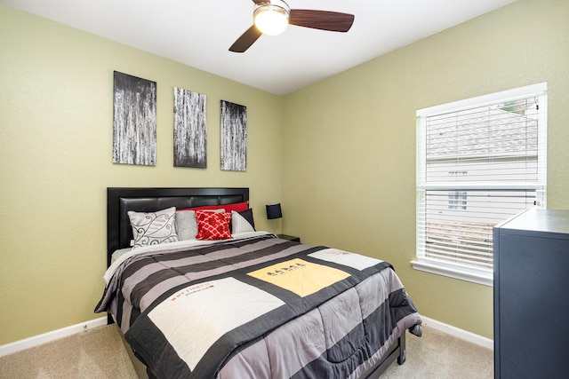 bedroom with carpet floors, baseboards, and ceiling fan