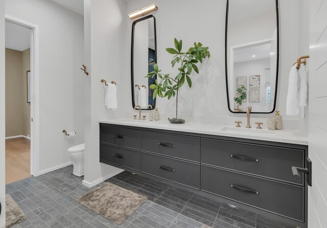 7091 Anna Dr, Brentwood, TN 37027 - full bathroom with toilet, tile patterned flooring, double vanity, and a sink