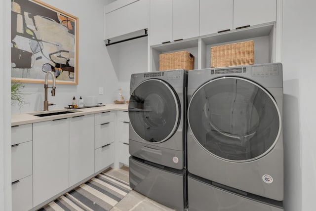 7091 Anna Dr, Brentwood, TN 37027 - washroom with separate washer and dryer, cabinet space, and a sink