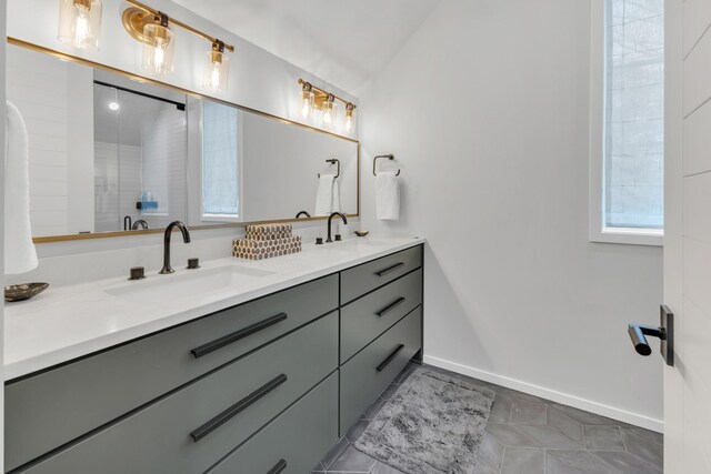 7091 Anna Dr, Brentwood, TN 37027 - full bathroom with tile patterned flooring, double vanity, a sink, and baseboards