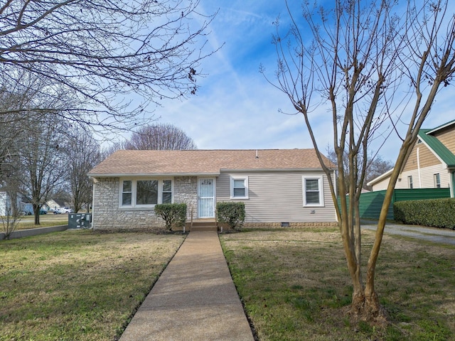 ranch-style house with a shingled roof, a front lawn, and crawl space