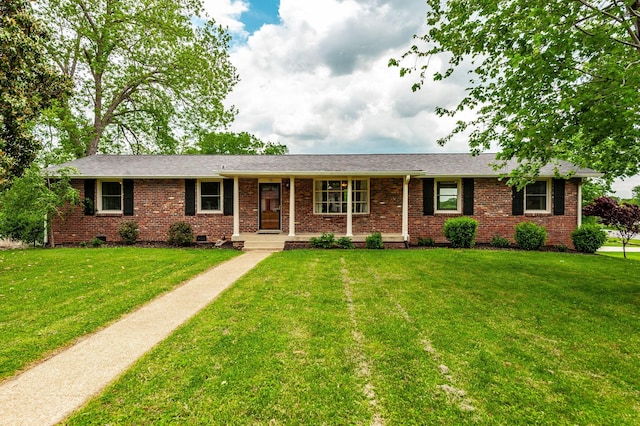 ranch-style home with brick siding, a front lawn, and crawl space