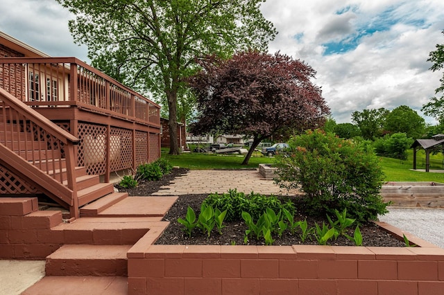 view of yard featuring stairway and a wooden deck