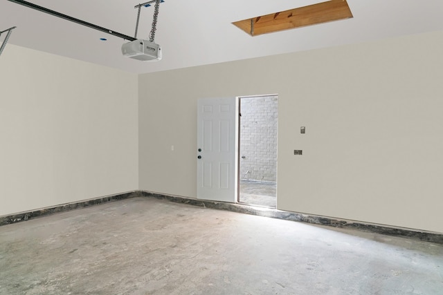 garage featuring baseboards and a garage door opener