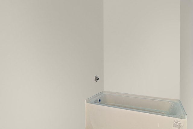 bathroom featuring a garden tub