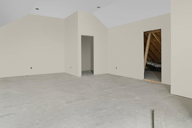 unfurnished living room featuring lofted ceiling