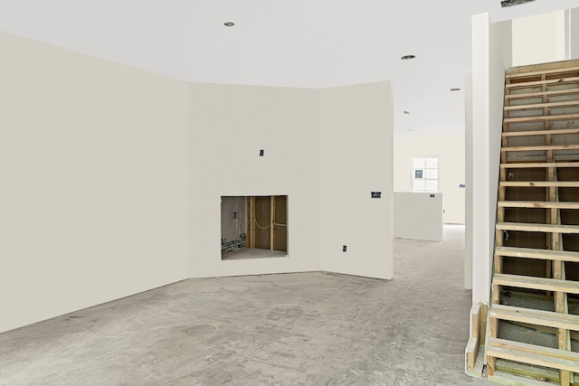 unfurnished living room featuring visible vents