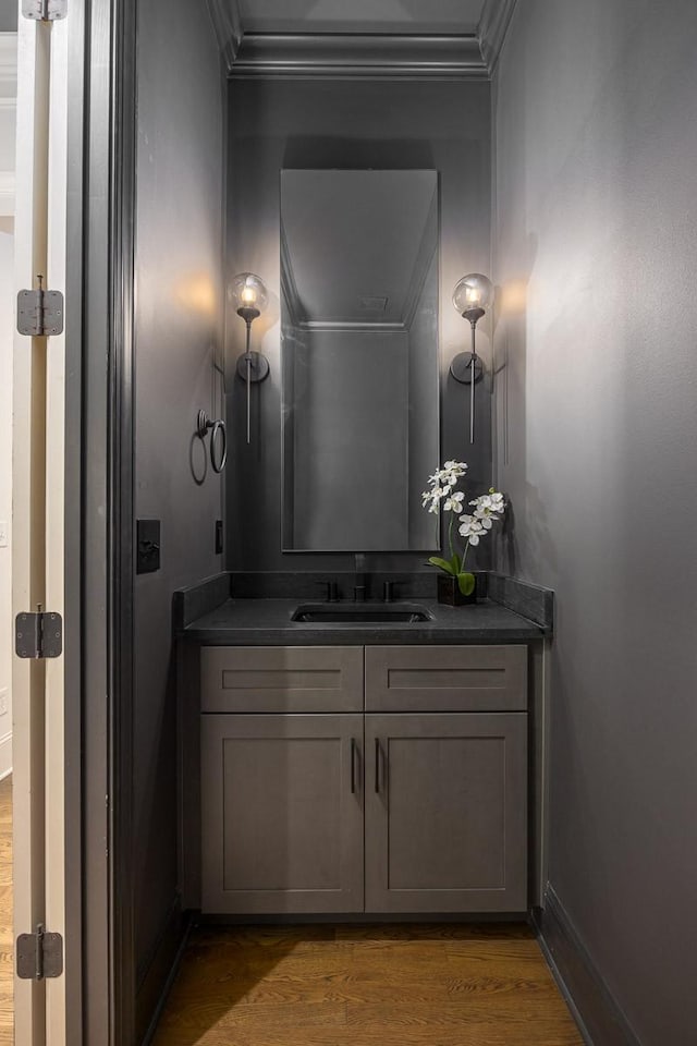9710 Onyx Ln, Brentwood, TN 37027 - bathroom featuring crown molding, baseboards, wood finished floors, and vanity