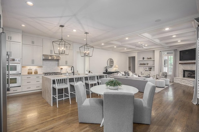9710 Onyx Ln, Brentwood, TN 37027 - dining space with recessed lighting, dark wood finished floors, and coffered ceiling