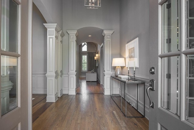 9710 Onyx Ln, Brentwood, TN 37027 - foyer with arched walkways, decorative columns, and dark wood-style floors
