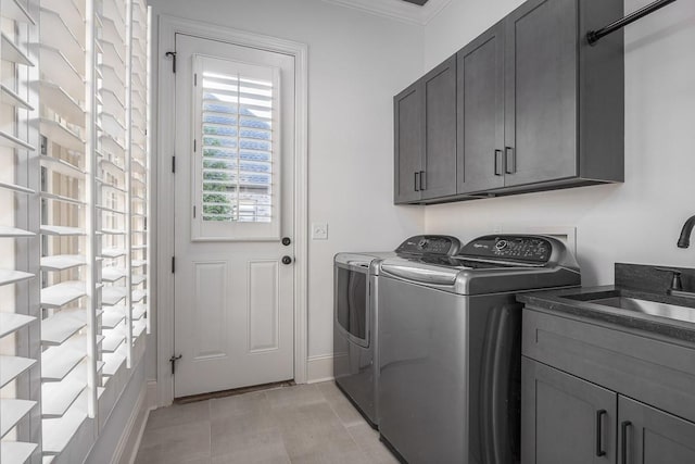 9710 Onyx Ln, Brentwood, TN 37027 - laundry room featuring a sink, crown molding, cabinet space, and washing machine and clothes dryer