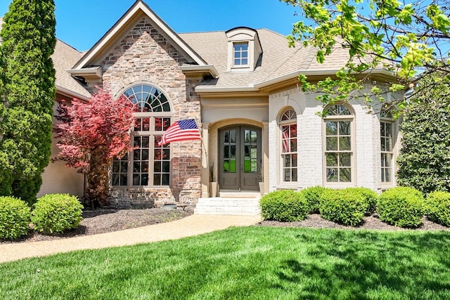 9710 Onyx Ln, Brentwood, TN 37027 - doorway to property featuring a yard, stone siding, french doors, and roof with shingles