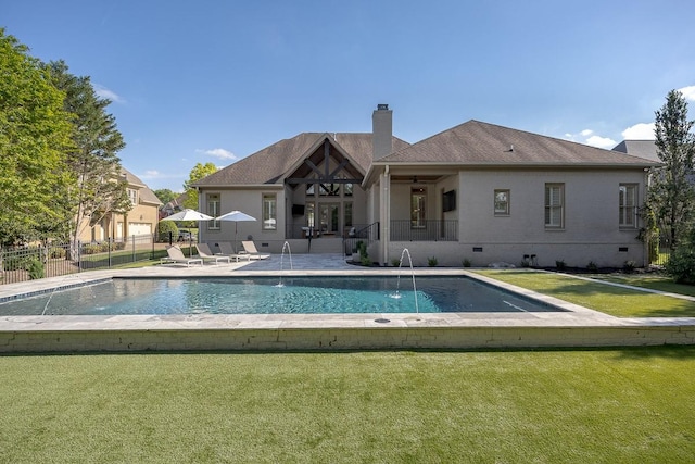 9710 Onyx Ln, Brentwood, TN 37027 - rear view of house with a chimney, a lawn, a patio area, fence, and a fenced in pool