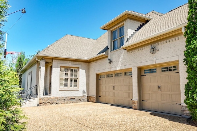 9710 Onyx Ln, Brentwood, TN 37027 - exterior space featuring brick siding, driveway, and a shingled roof