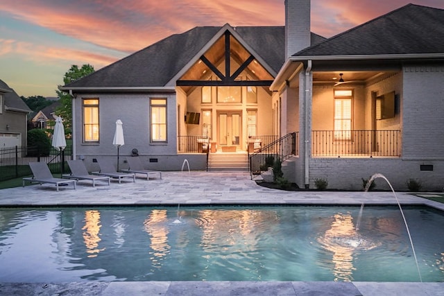 9710 Onyx Ln, Brentwood, TN 37027 - pool at dusk featuring fence, a fenced in pool, and a patio