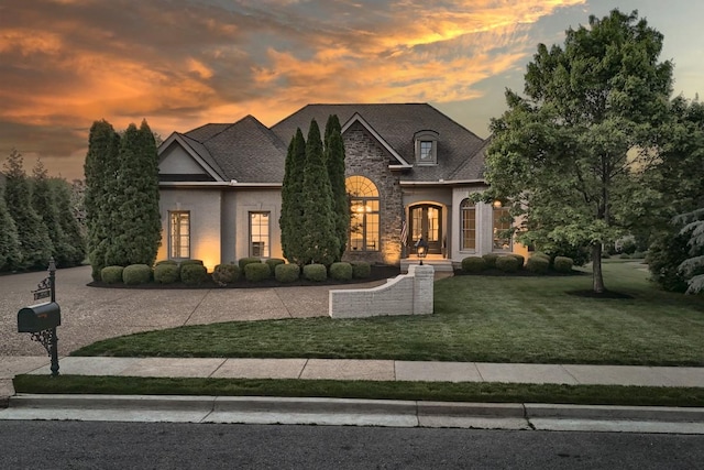 9710 Onyx Ln, Brentwood, TN 37027 - french country home with a yard, stone siding, and stucco siding
