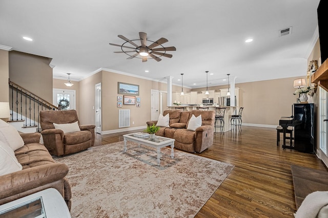 living room with stairway, baseboards, ceiling fan, and dark wood-type flooring