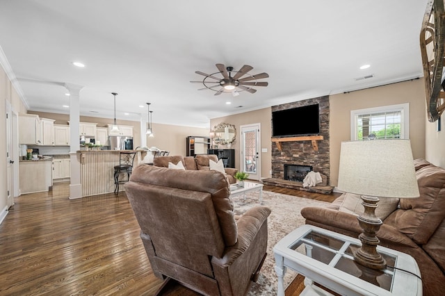 living room with crown molding, recessed lighting, ceiling fan, and dark wood finished floors