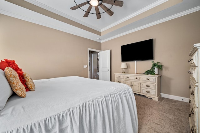 bedroom with crown molding, light carpet, baseboards, a raised ceiling, and a ceiling fan