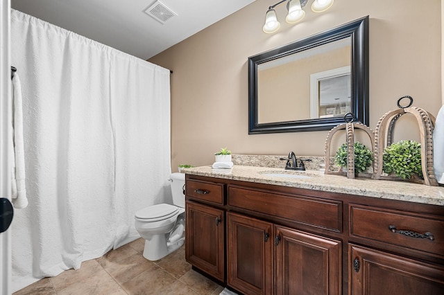 bathroom with toilet, visible vents, tile patterned flooring, and vanity