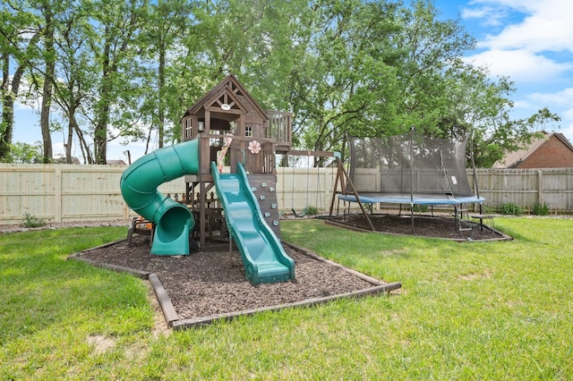 view of play area with a lawn, a fenced backyard, and a trampoline