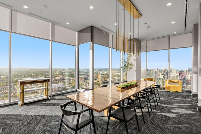 sunroom / solarium with a city view and a wealth of natural light