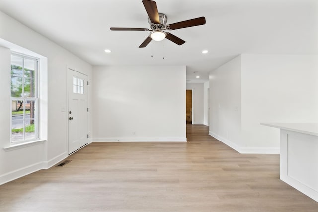 entryway featuring visible vents, a ceiling fan, light wood finished floors, and recessed lighting