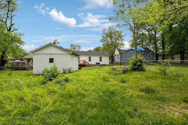 view of yard featuring a deck and a fenced backyard