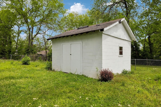 view of shed with fence