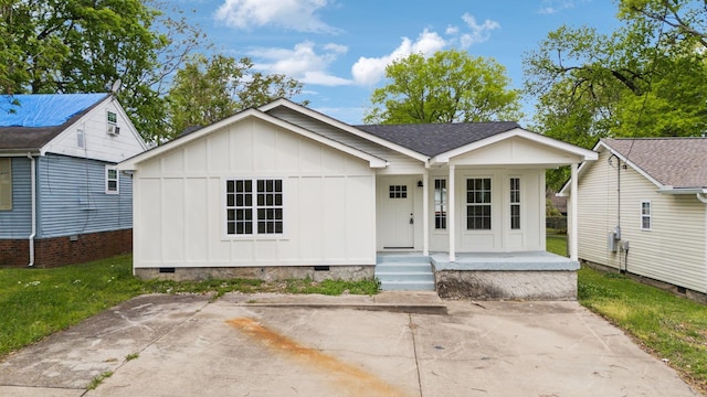 view of front of home featuring a porch, crawl space, board and batten siding, and roof with shingles