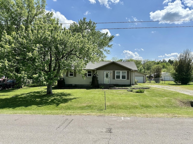 ranch-style home with fence, dirt driveway, a front lawn, and a garage