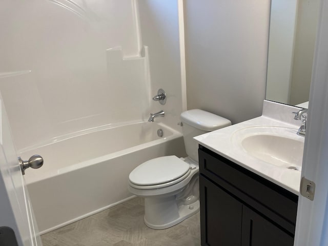 bathroom with toilet,  shower combination, and vanity