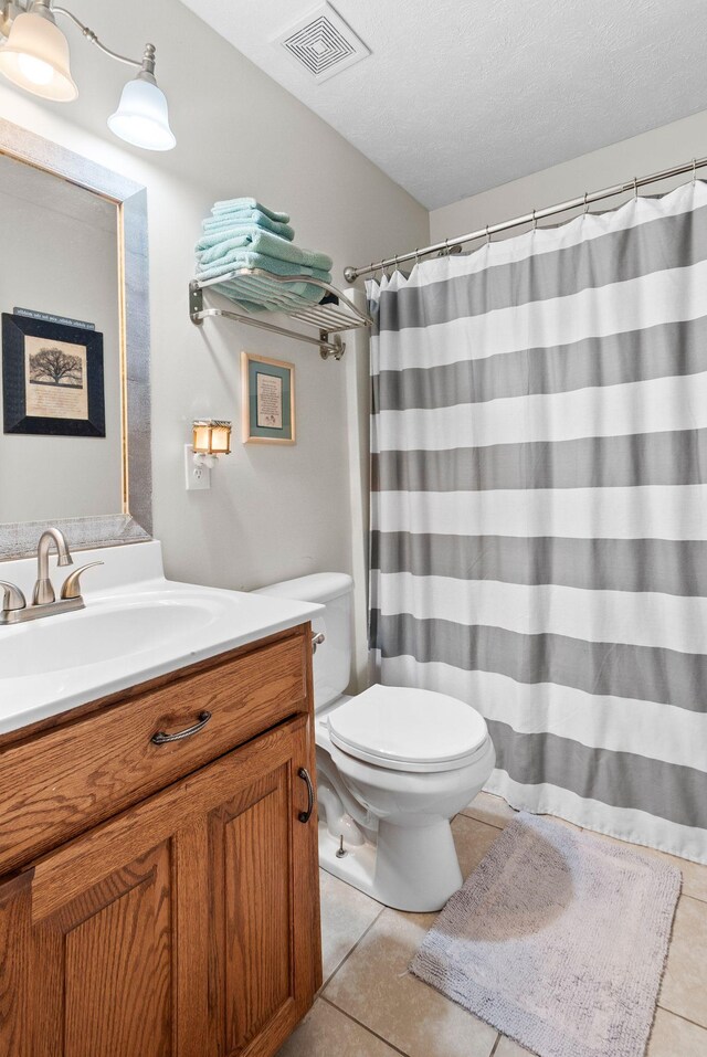 204 Commanche Dr, Hohenwald, TN 38462 - full bathroom with visible vents, curtained shower, tile patterned floors, vanity, and toilet